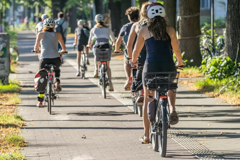 People riding bicycles on separated bike trail.